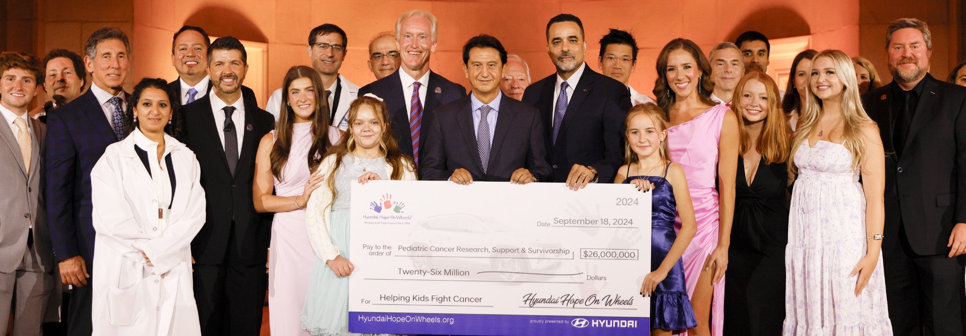 helping kids fight cancer foundation showing their big check from hyundai hope on wheels - CardinaleWay Hyundai of El Monte in El Monte CA
